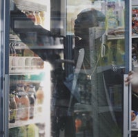 a man standing in front of a refrigerator